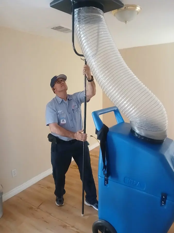 Furnace Tune-Up technician using HEPA equipment in Perry Hall